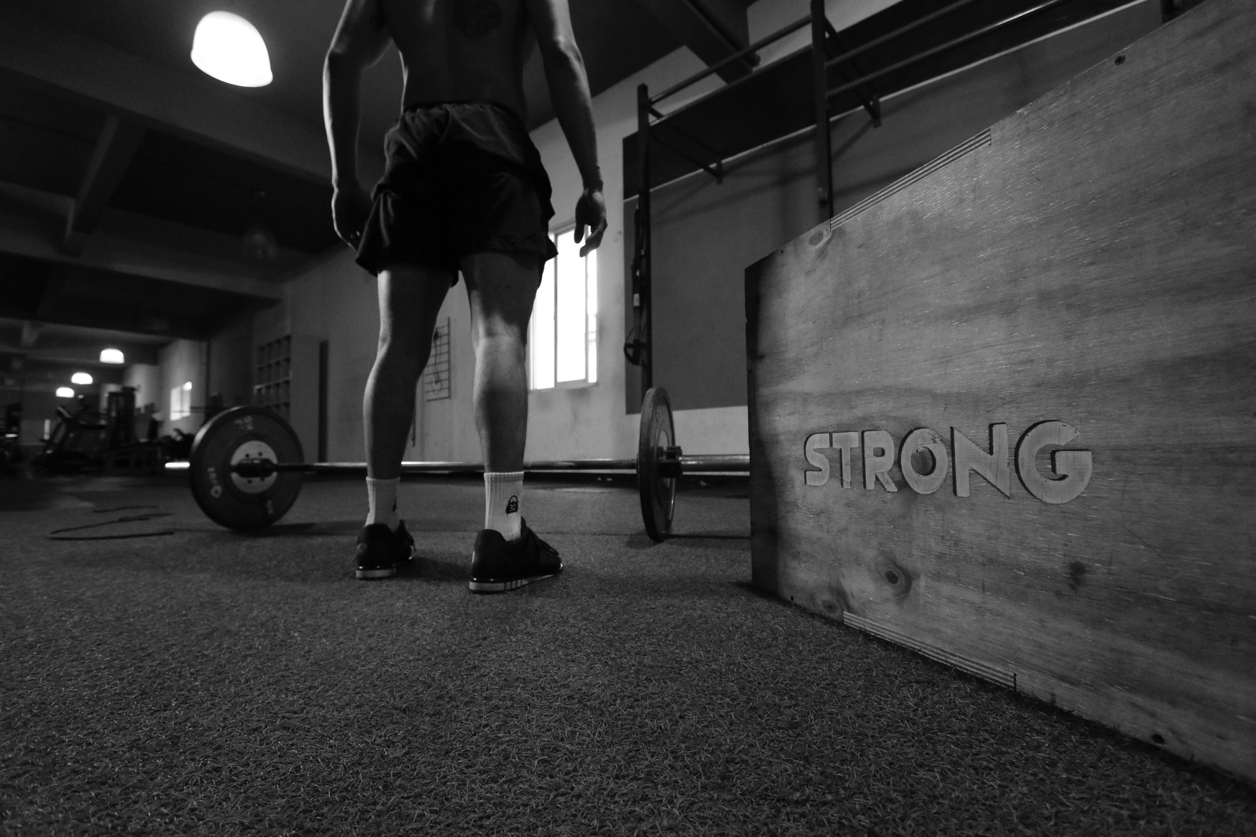 man with loaded barbell - deloading